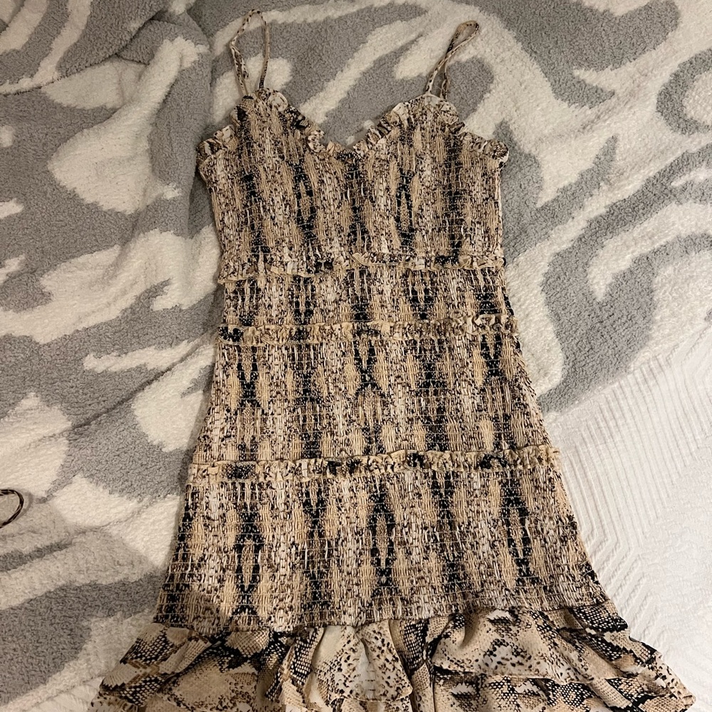 Snake skin print dress, fitted with ruffle detailing.